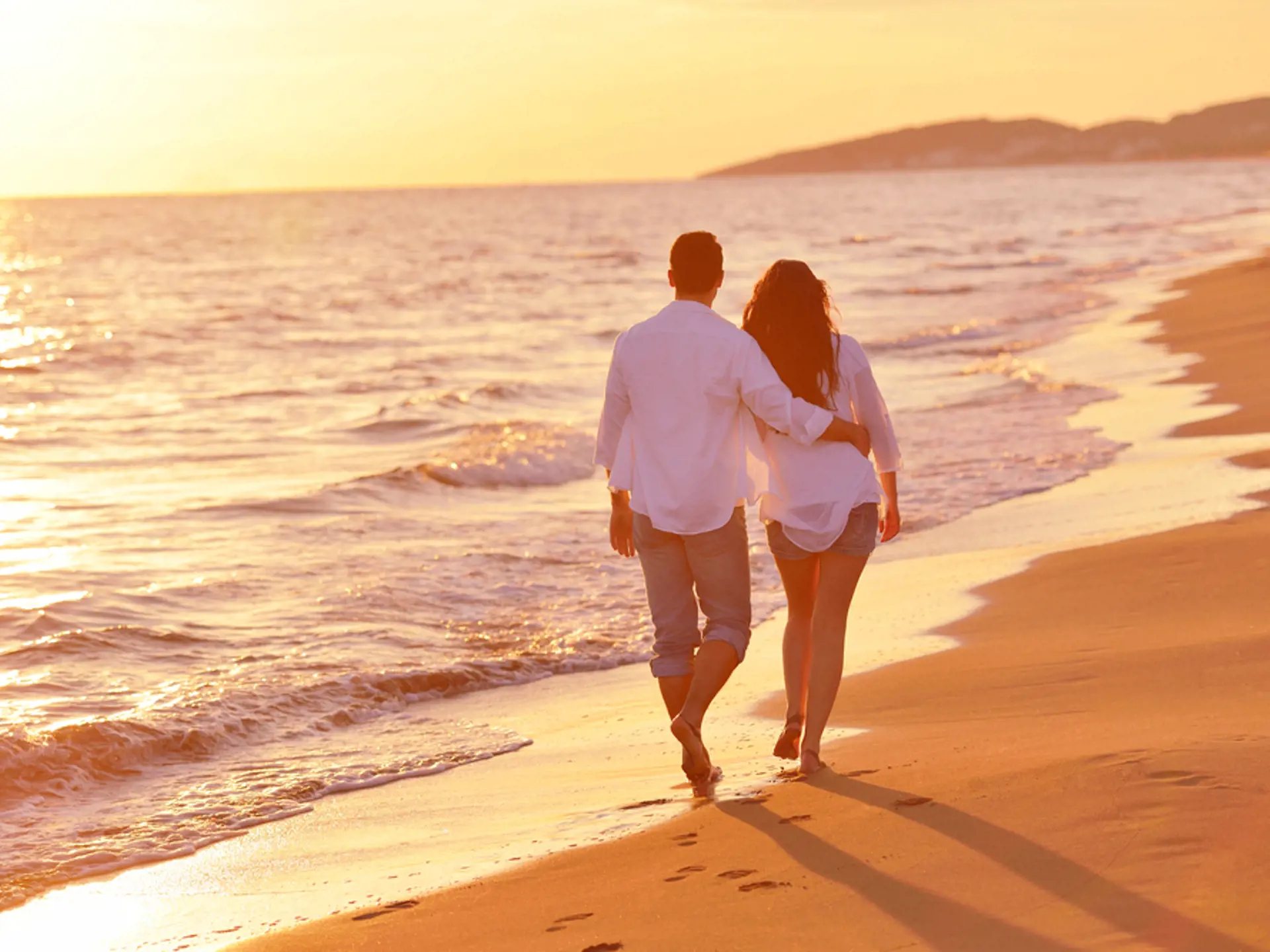 happy young romantic couple in love have fun on beautiful beach at beautiful summer day.jpeg