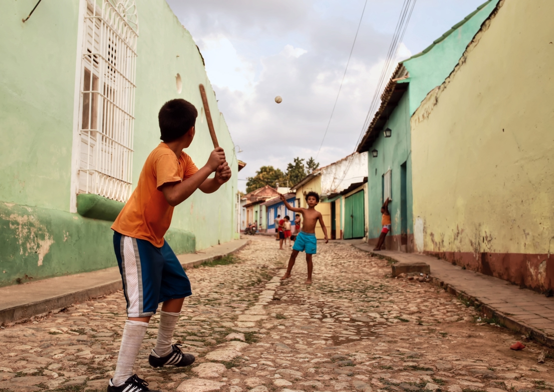shutterstock_464100611 TRINIDAD - CUBA  12.03.2015 Kids are playing baseball in the streets in Trinidad.jpg