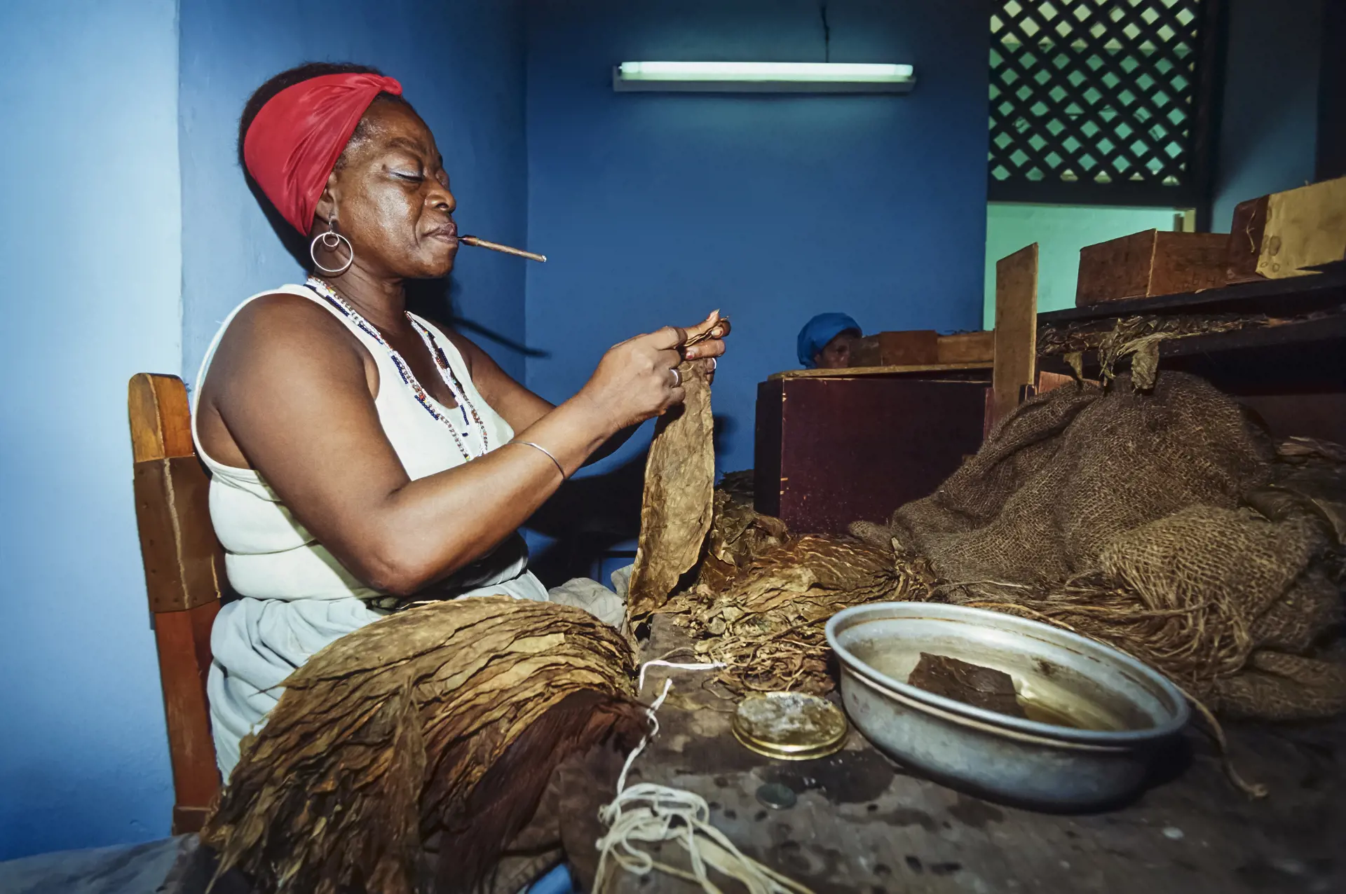 shutterstock_243867106 Pinar Del Rio, cuban woman working in a cigars factory - FILM SCAN.jpg