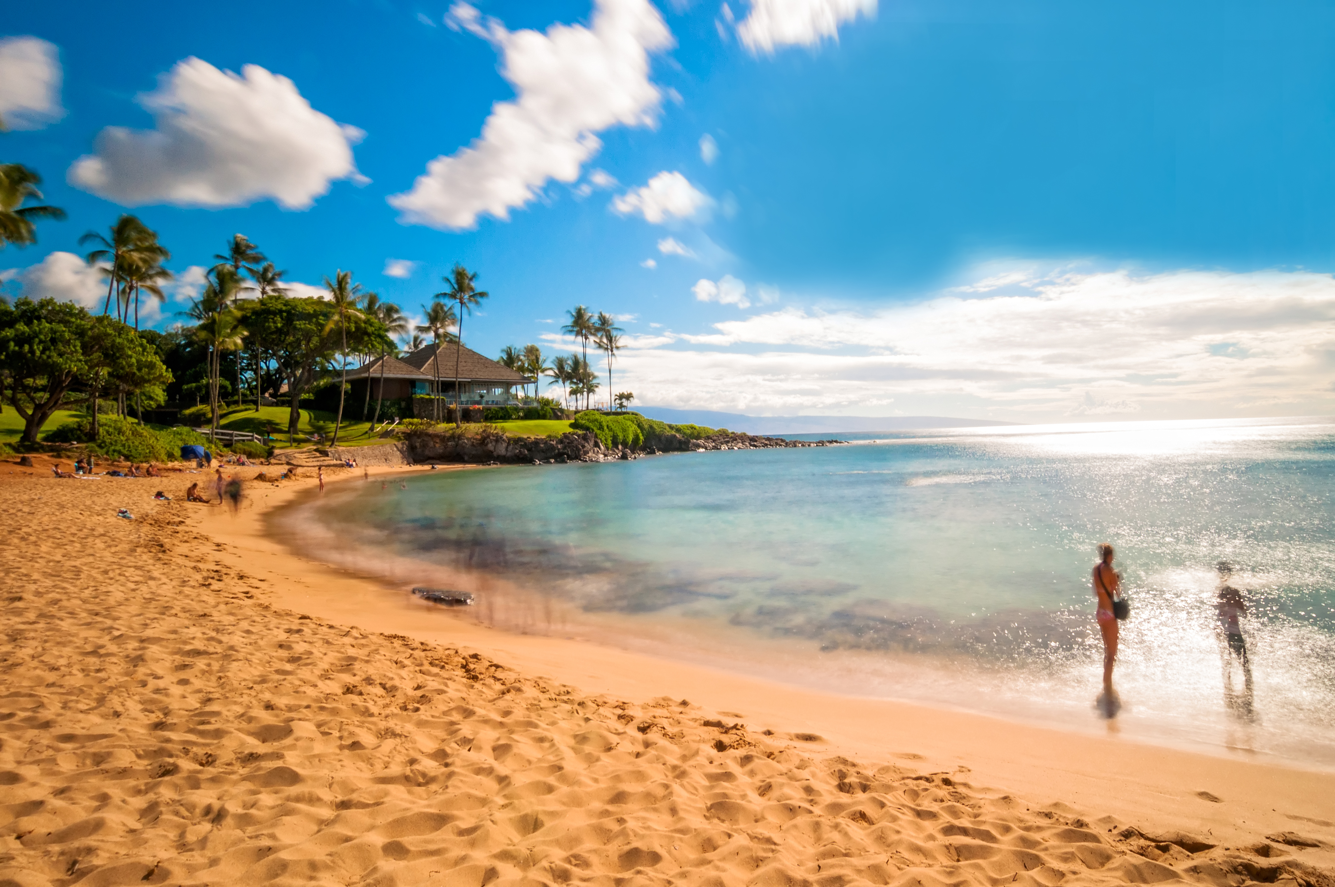shutterstock_172737974 MAUI, HAWAII - SEPTEMBER 4, 2013 long exposure of unidentified tourists enjoying sunset on famous Kaanapali beach in West Maui, Hawaii..jpg