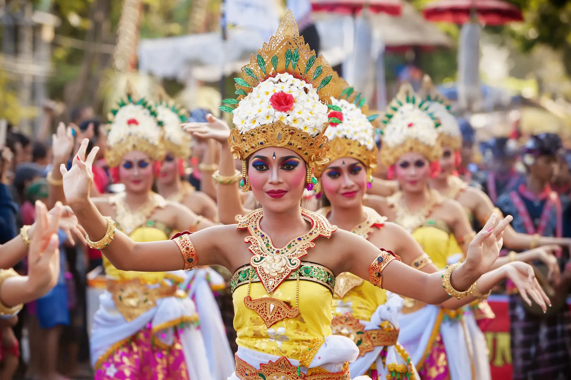 shutterstock_347774750 BALI, INDONESIA - JUNE 13, 2015 Women group dressed in colorful sarongs - Balinese style female dancer costume, dancing traditional temple dance Legong at Bali Art and Culture Festiv.jpg