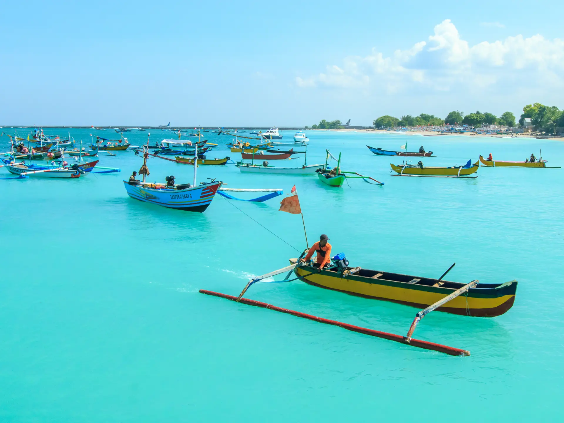 shutterstock_622035740 Unidentified fisherman on a boat in Jimbaran Beach, Bali, Indonesia..jpg