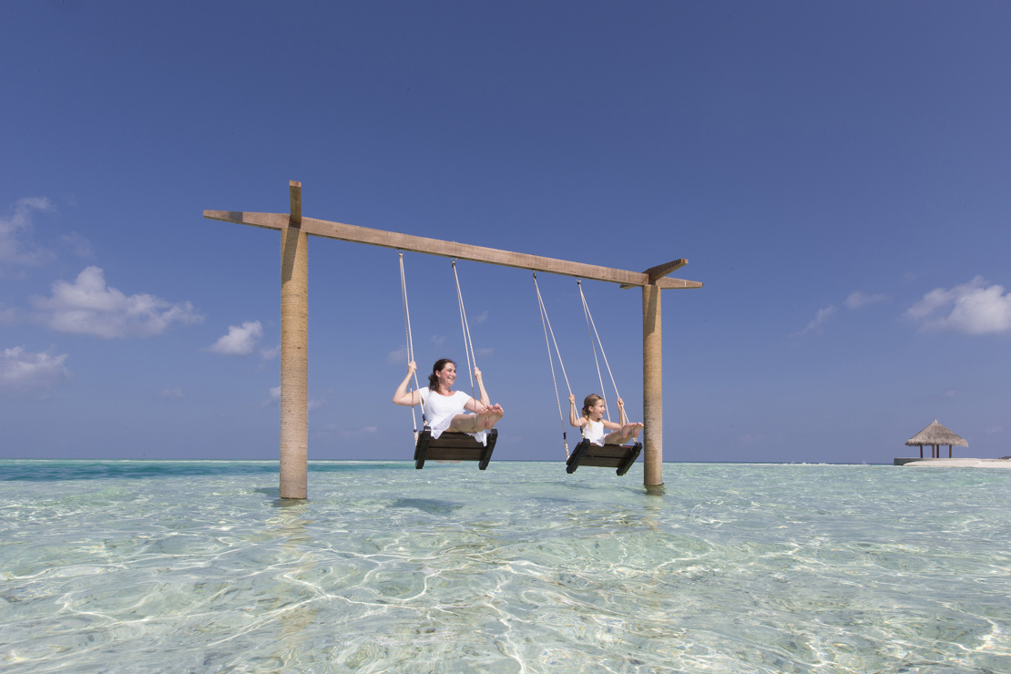 61887159-H1-Family_on_Beach_Swing.jpg
