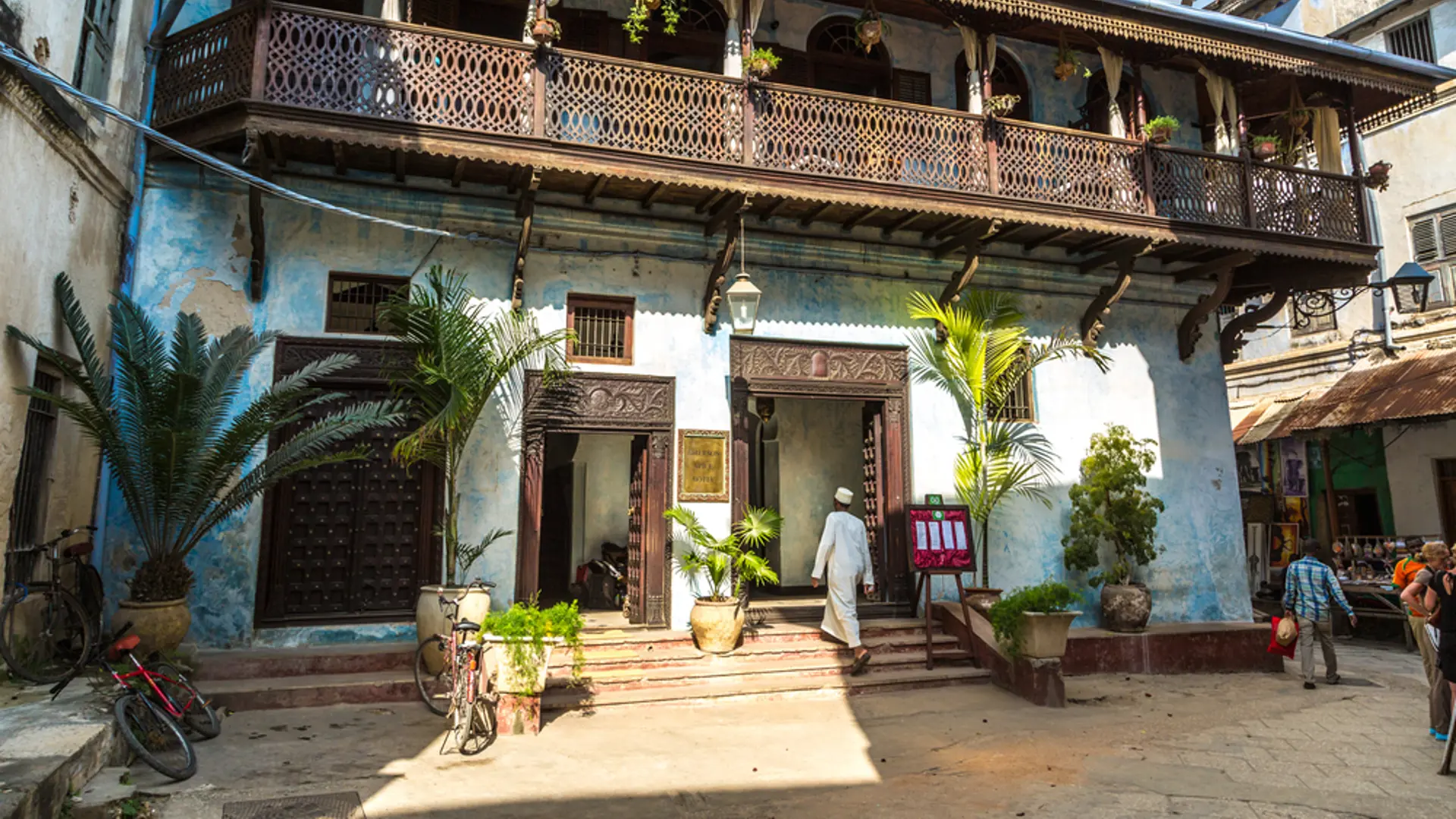 Local People On A Typical Narrow Street In Stone Town