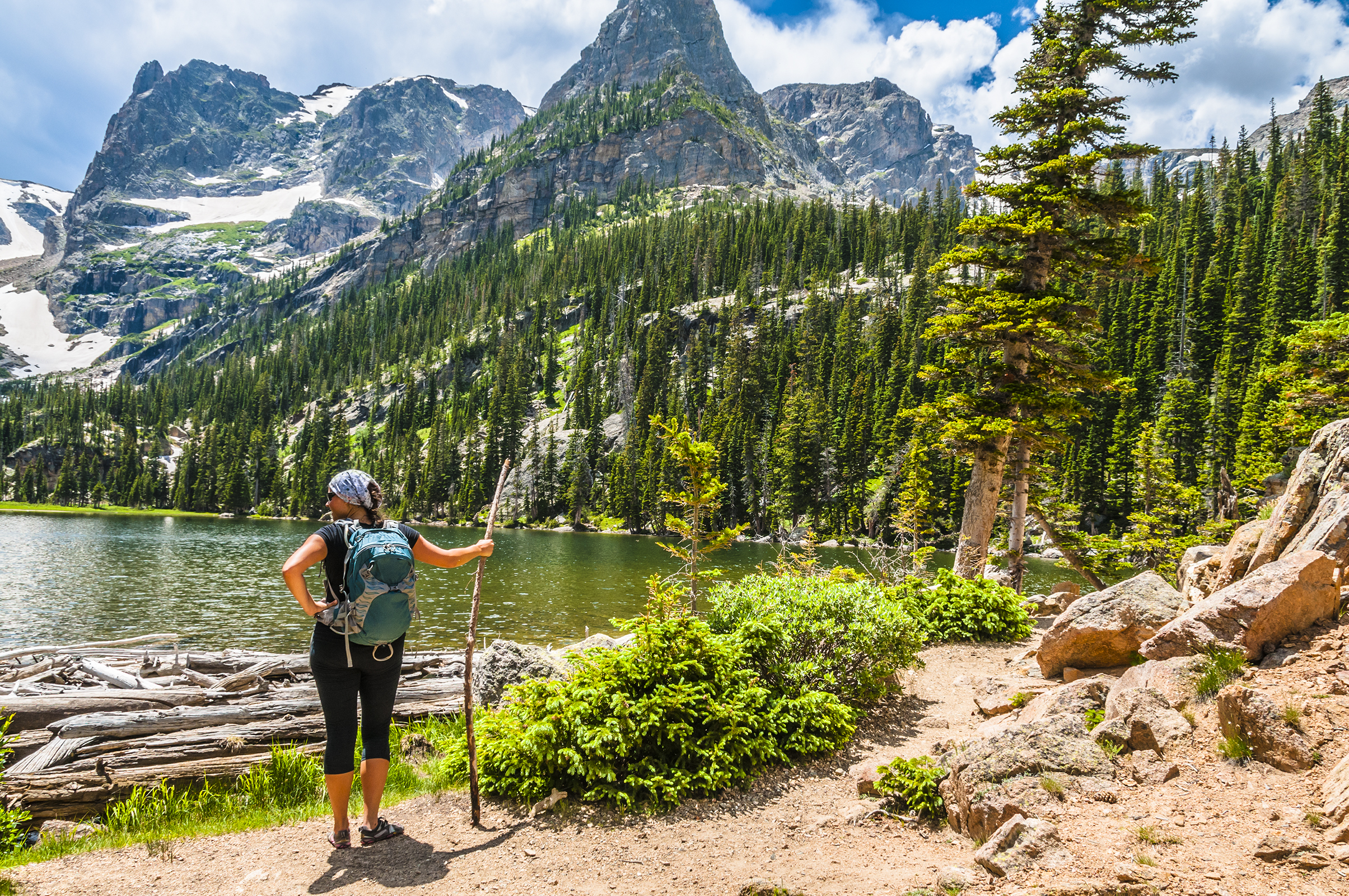 dag 3shutterstock_208574044 female enjoying stunning view at lake Odessa with notchtop peak in rocky mountain NP.jpg