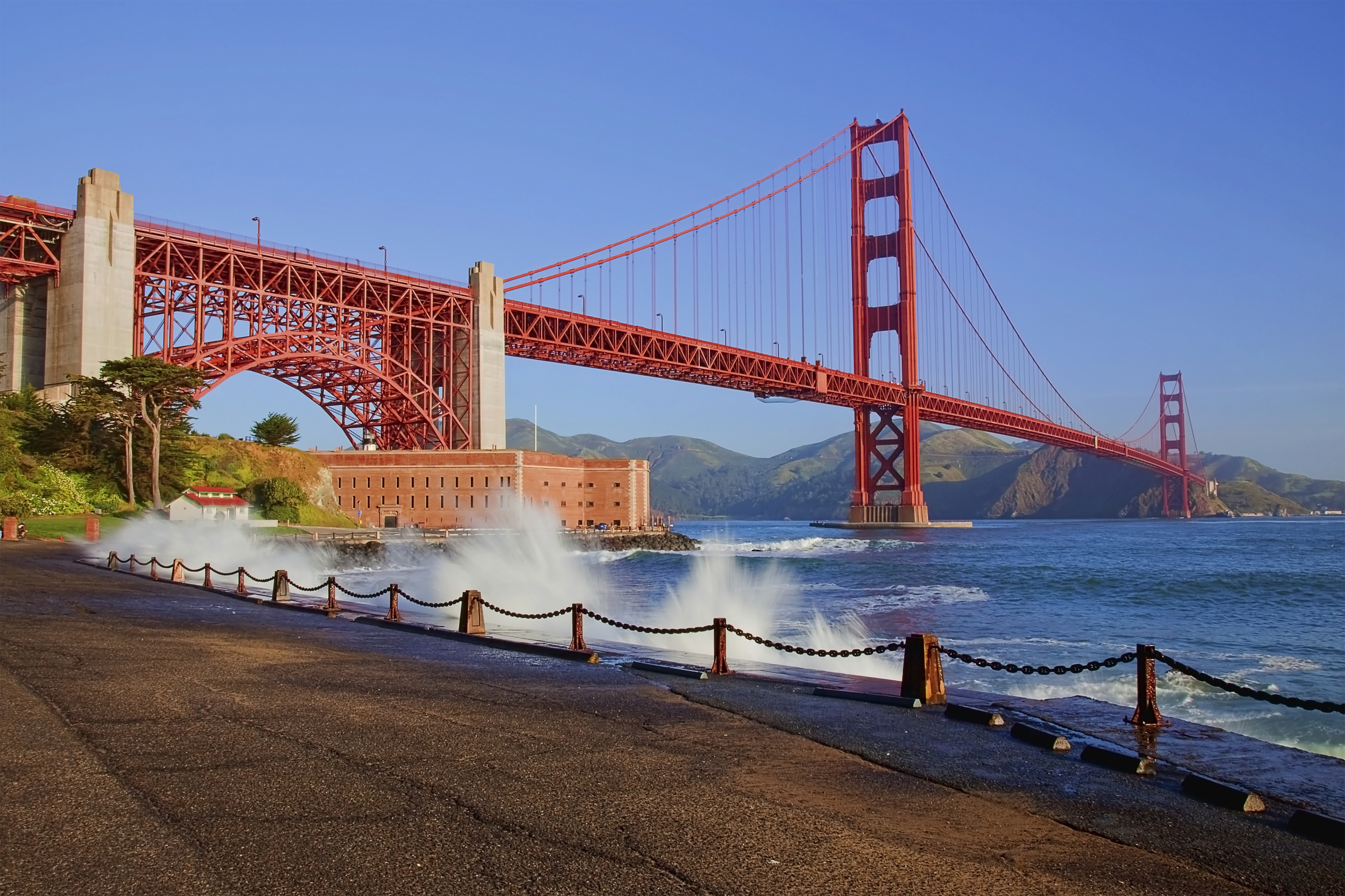 Golden Gate Bridge With Wave Splashing On The Shore Line 50929669