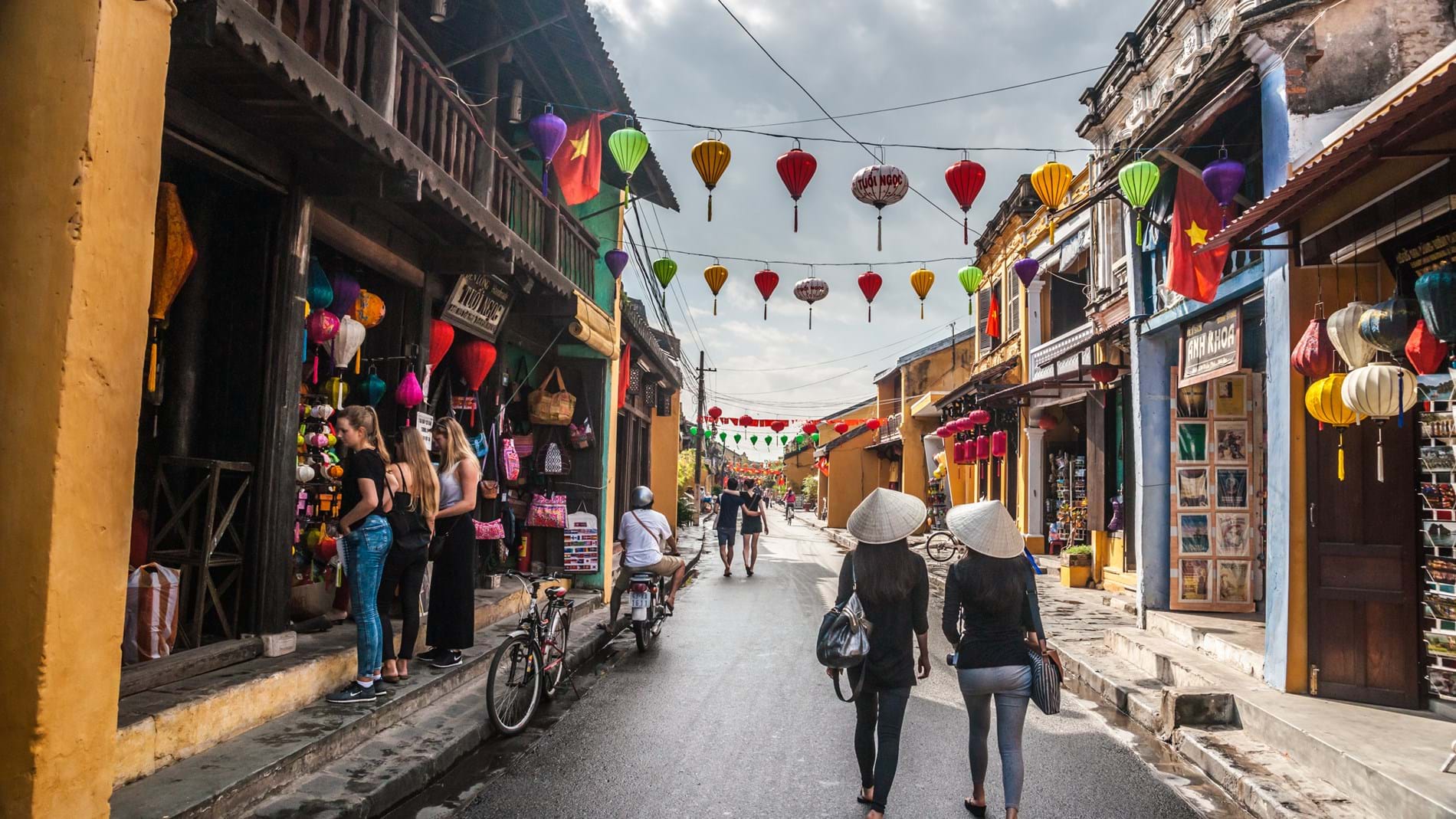 Hoi An Viet Nam Two Unidentified Asian Female Tourists In Traditional Vietnamese Conical Hats Walk