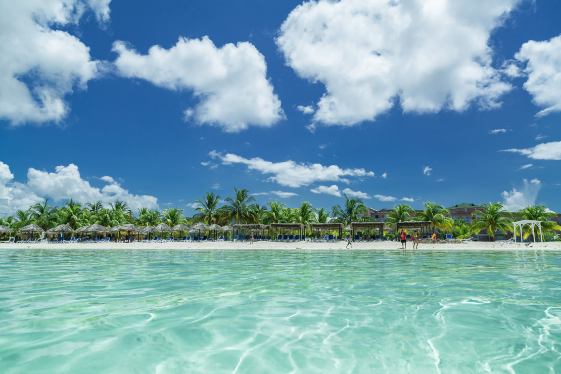 shutterstock_323165090 stunning splendid amazing inviting view of Cuban, Cayo Coco beach from the tranquil turquoise ocean side, with people.jpg