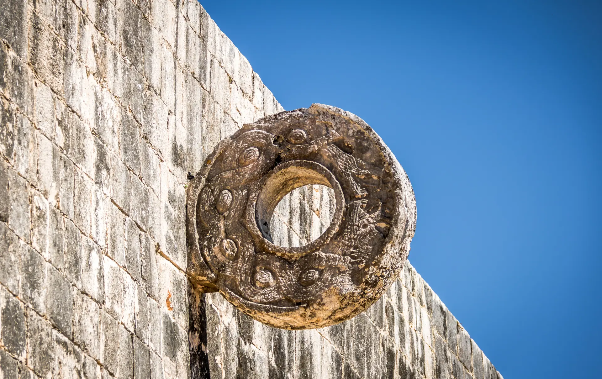 shutterstock_499950019 Detail of hoop at ball game court (juego de pelota) at Chichen Itza - Yucatan, Mexico.jpg