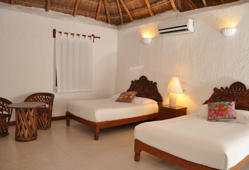 ISLA MUJERES - I har seks nætter på det hyggelige hotel Na Balam, hvor I bor på et rummeligt Standard Poolside Room.