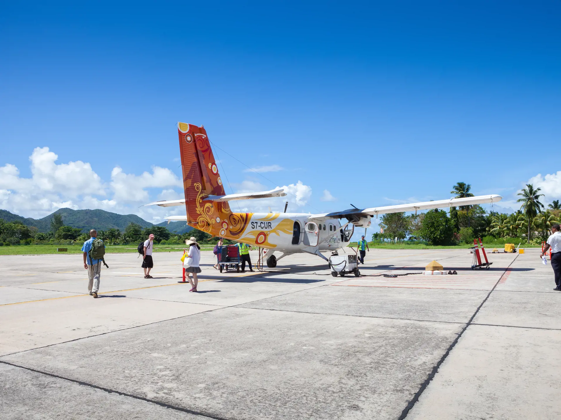 shutterstock_720707206 Praslin, Seychelles Passengers at the airport go on board the aircraft Air Seychelles, Praslin, Seychelles..jpg