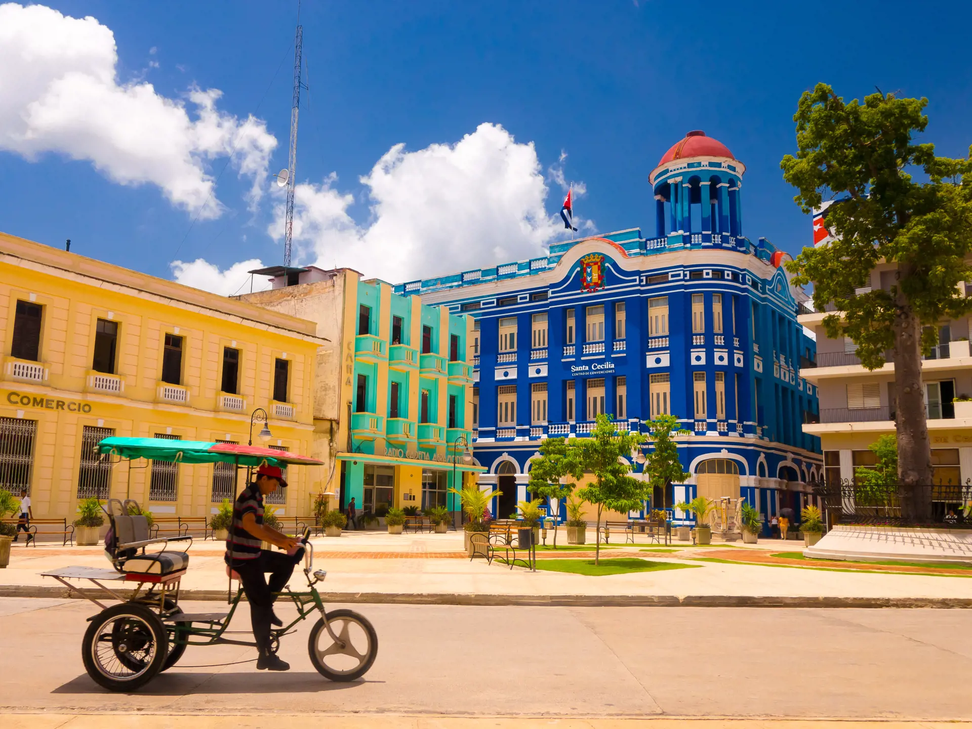 shutterstock_319284563 CAMAGUEY Street view of UNESCO heritage city centre, old square with bicycles used for transport.jpg