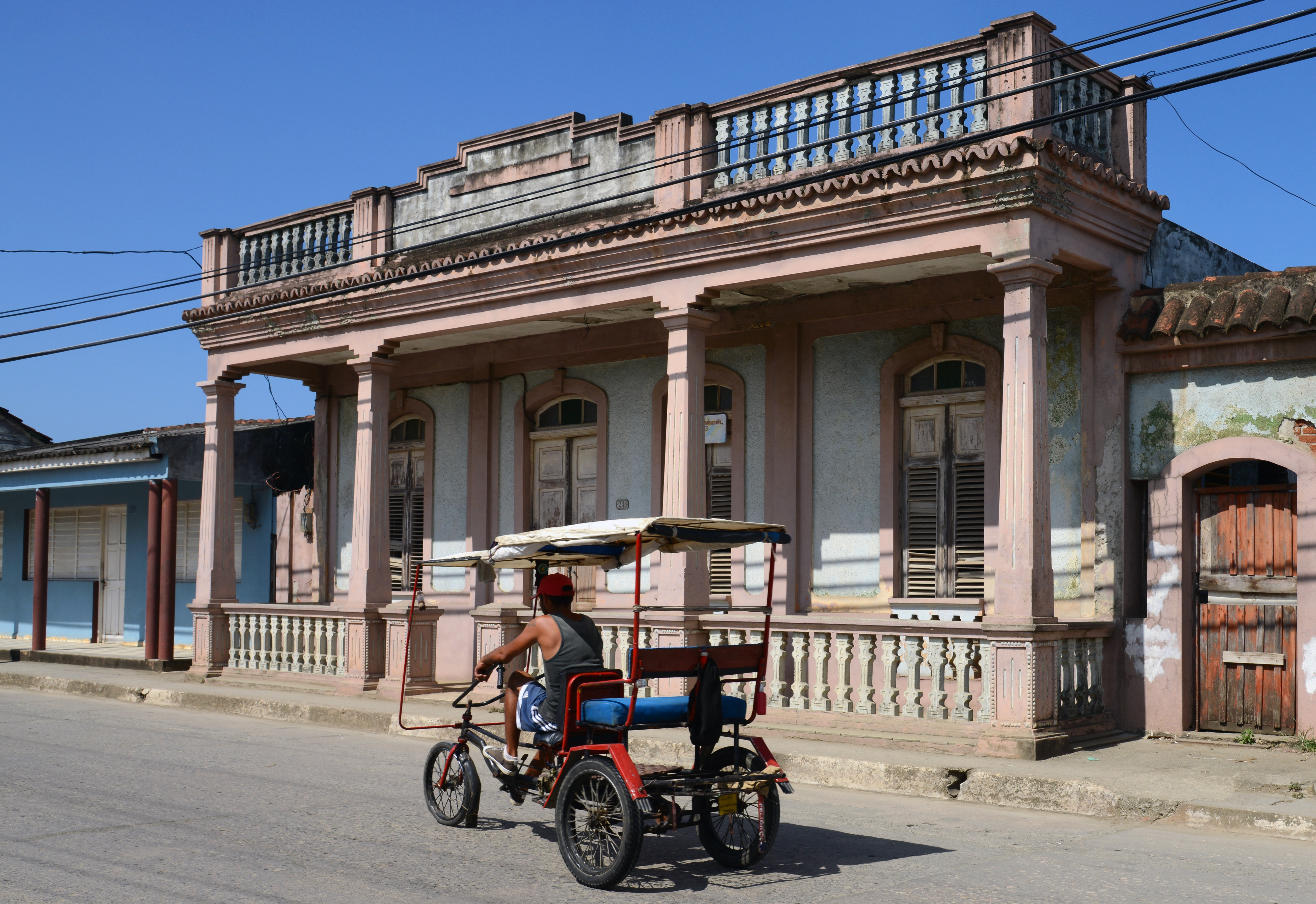 shutterstock_203167909 Rickshaw-style tricycle taxi in main street in Baracoa.jpg