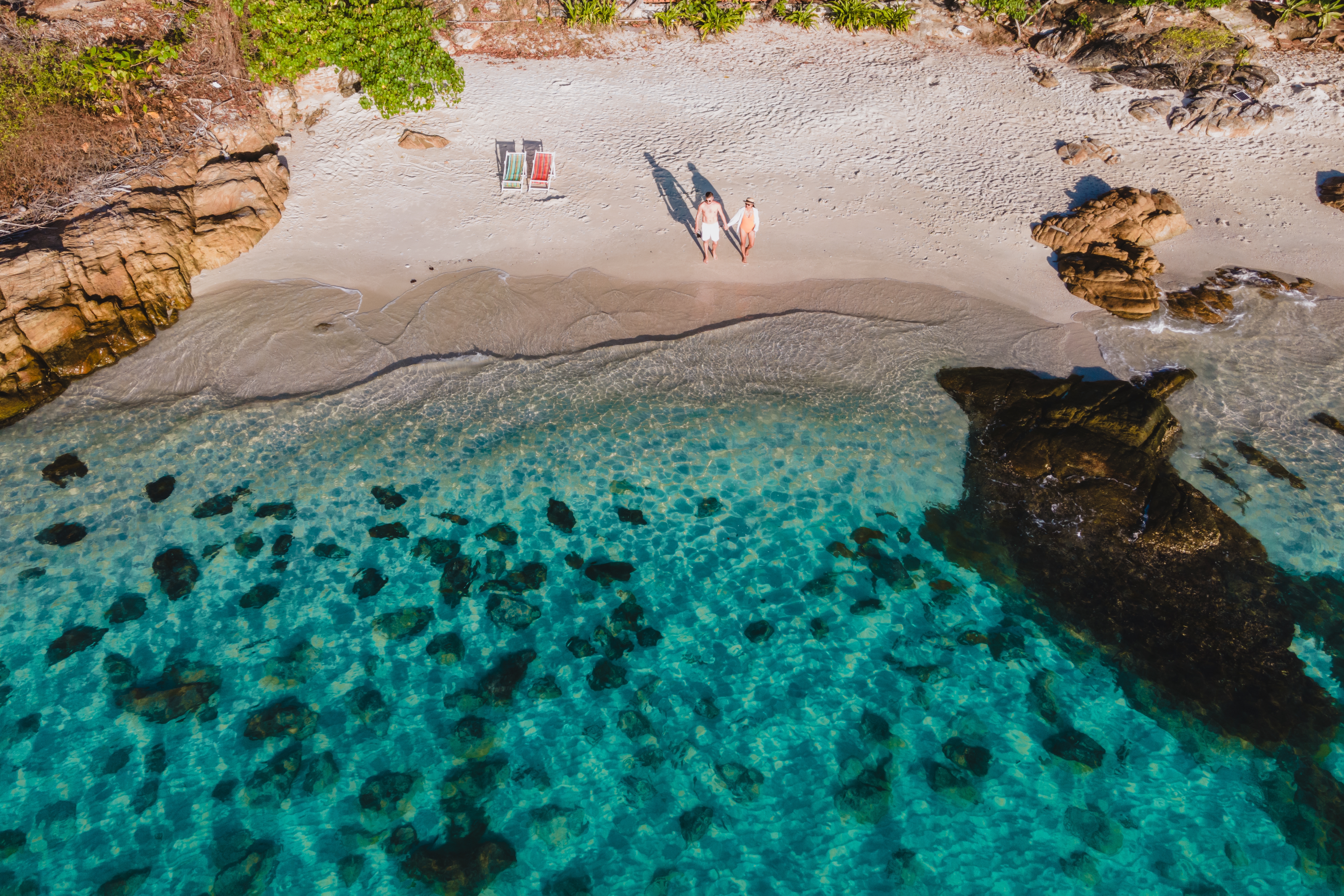 Shutterstock 2399697897 (Koh Samet Island Thailand, Aerial Drone View From Above At A Couple Of Men And Woman On The Beach Of Samed Island In Thailand)