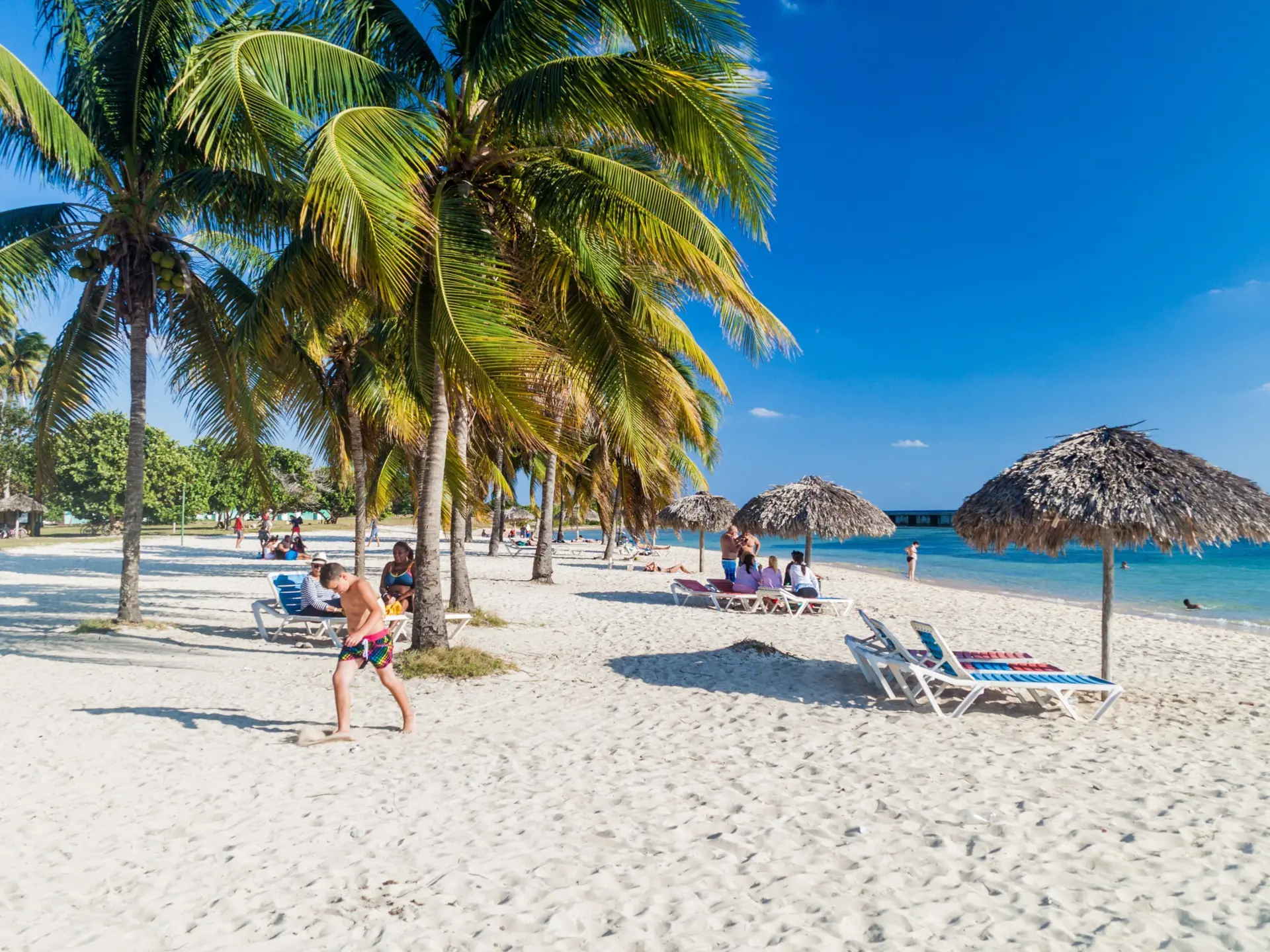 Shutterstock 473025436 Tourists At The Beach Playa Giron, Cuba