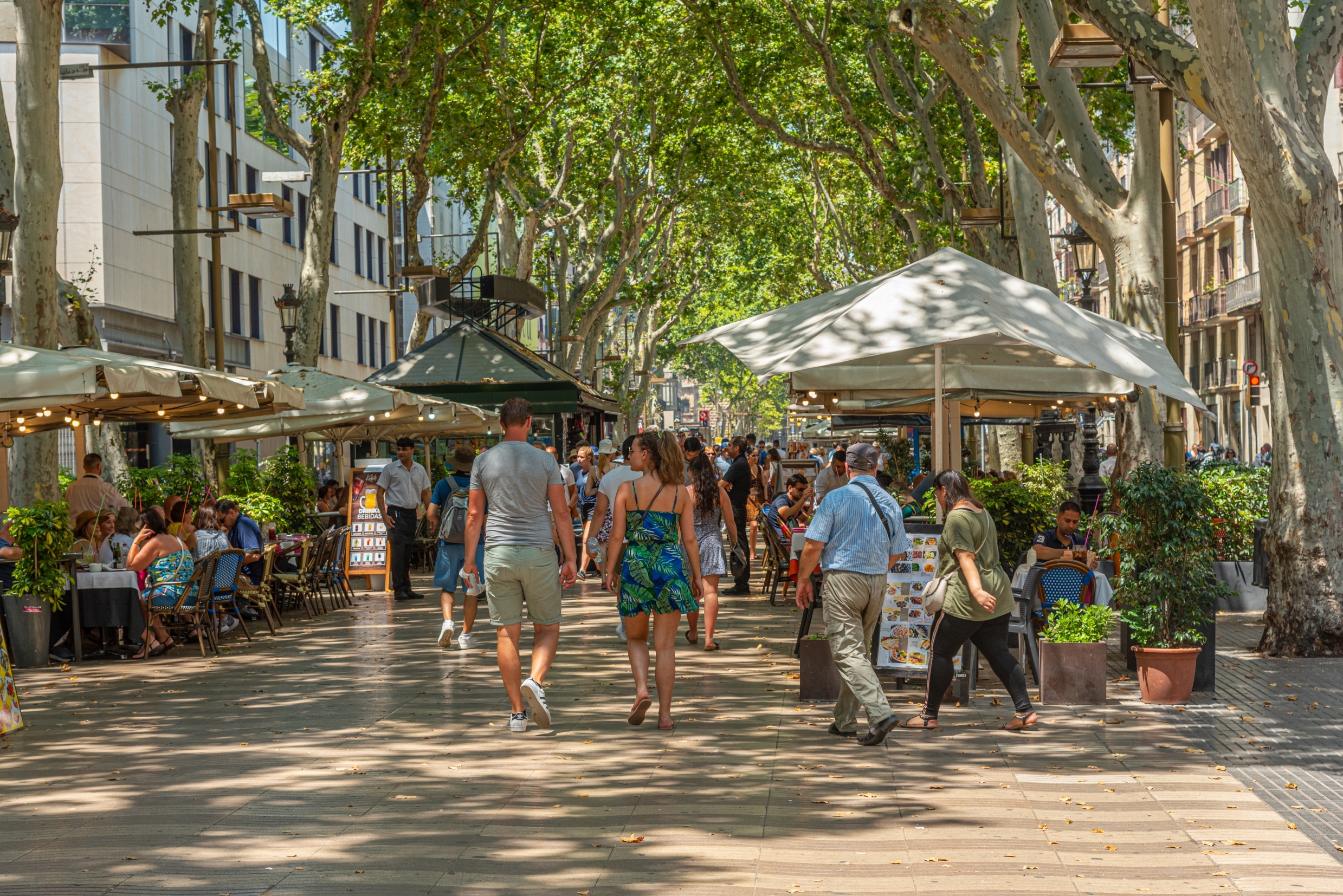 Shutterstock 2034042755 (BARCELONA, SPAIN, JUNE 30, 2019 People Are Strolling At La Rambla Street In Barcelona, Spain)