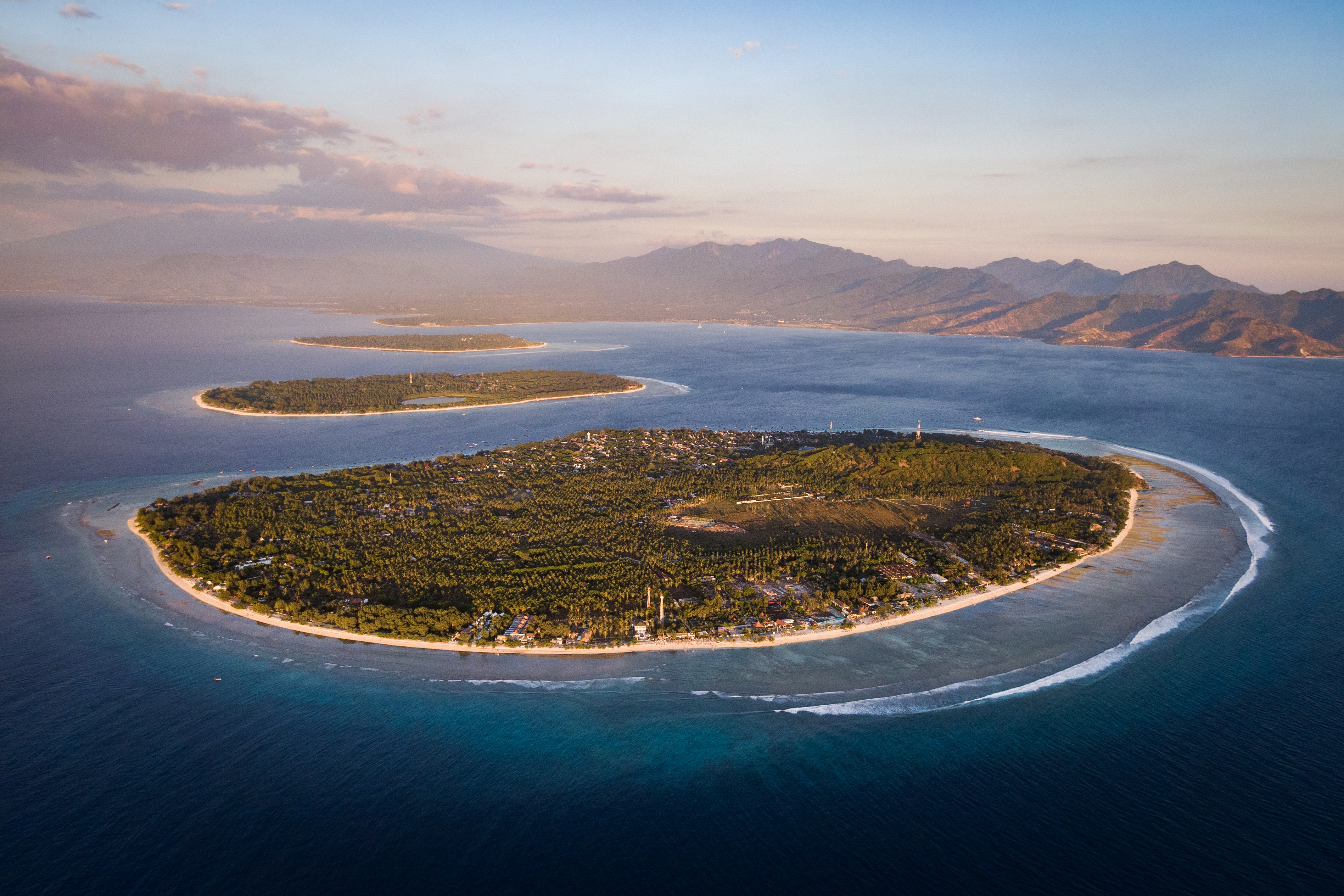 Shutterstock 1455243779 (Aerial View Of The Gili Islands Off The Coast Of Lombok, Indonesia, At Sunset. The Gilis Are The Most Popular Tourist Destination In Lombok.)