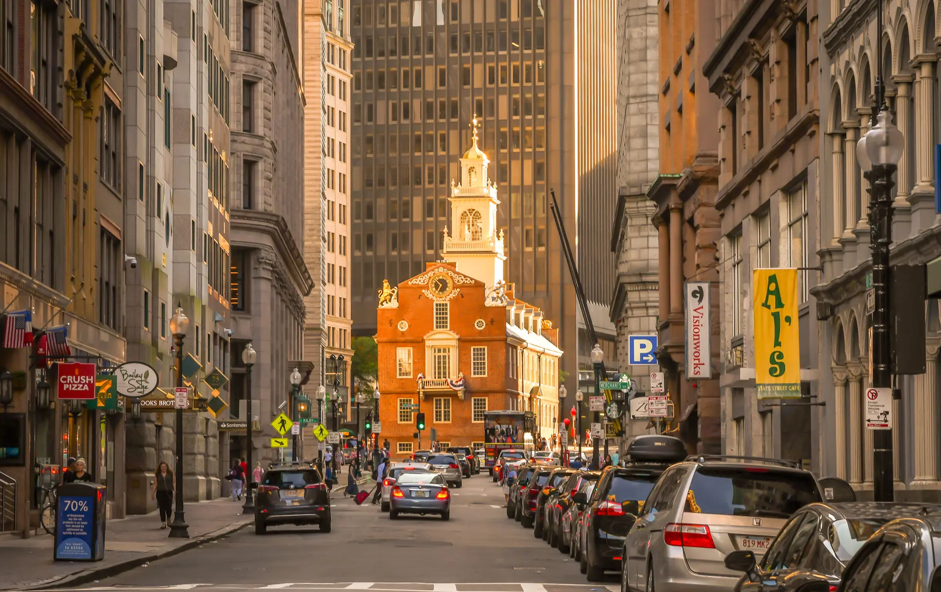 Shutterstock 1455713798 Boston, MA 7719 The View Down State Street, With The Setting Sun Illuminating The Old State House