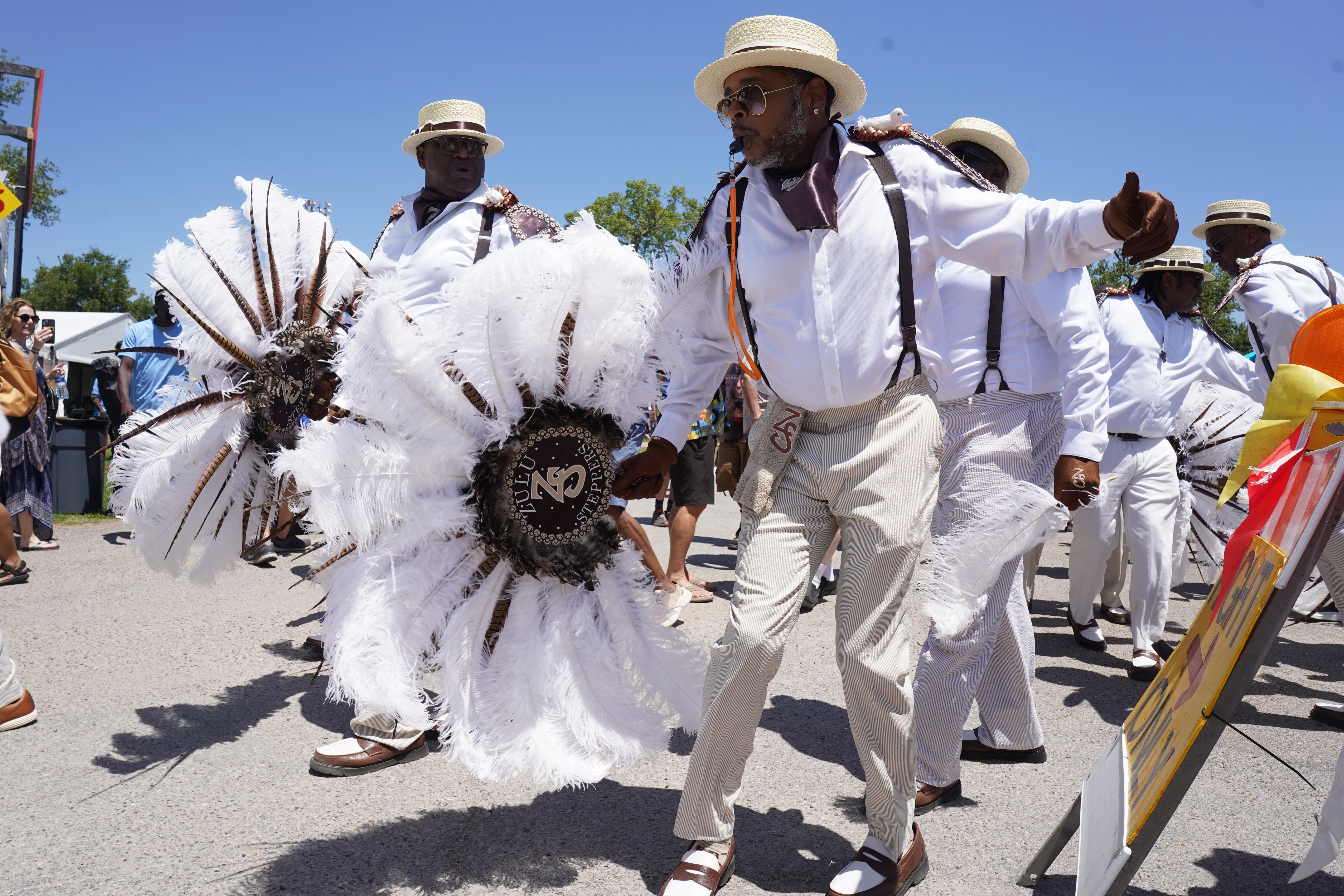 Shutterstock 2455718185 New Orleans, LA April 25, 2024 The Zulu Steppers March At The 2024 New Orleans Jazz And Heritage Festival.